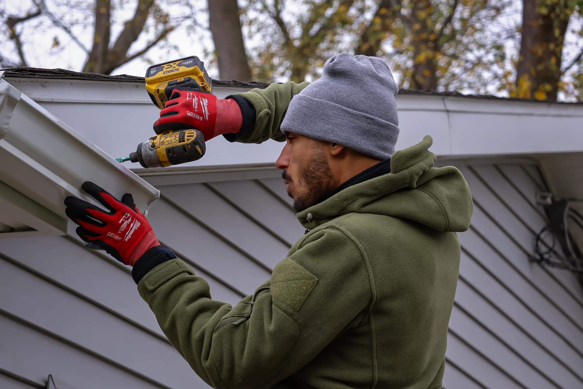 guy installing gutters